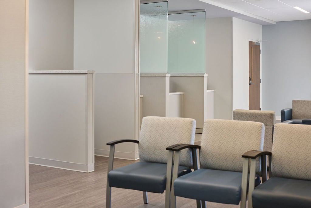 Empty patient seating area and check-in reception desk in a modern cardiology clinic waiting room at Richmond heart and vascular